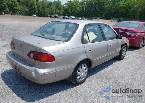 2002 Toyota Corolla Le z USA, uszkodzony, nr VIN 2T1BR12EX2C577933